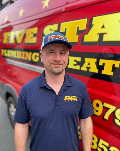 Bart from Five Star Plumbing and Heating beside the company service van